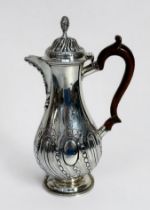 A Victorian silver coffee pot by George Fox, of baluster form with reeded and floral decoration to