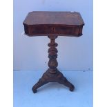 A Regency rosewood ladies worktable, the elongated octagonal top with concave front edge,enclosing a
