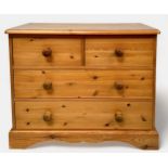 A pine chest of two short, over two long drawers, raised on shaped bracket supports, 92cm wide