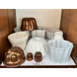 A collection of twenty-one assorted ceramic and metal jelly moulds in various sizes and shapes,