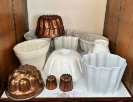 A collection of twenty-one assorted ceramic and metal jelly moulds in various sizes and shapes,
