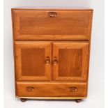 An Ercol blonde elm Windsor model 430 serving cabinet or drinks cabinet, with fall-front above