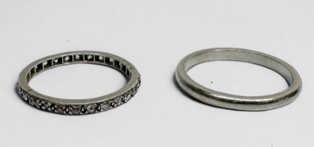 A platinum wedding ring, and a white metal full eternity ring, set with small old cut diamonds,