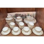 A twelve setting Noritake part tea service, comprising cups, saucers, plates, platters, a jug and