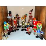 Fourteen assorted Murano glass clowns in various sizes and colours, including examples modelled as a