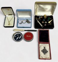 Assorted costume jewellery, including tie-pins, tie-slides, white metal Naval crown brooch, a