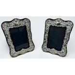 A pair of silver fronted easel picture frames, with floral and scrolled decoration, hallmarked