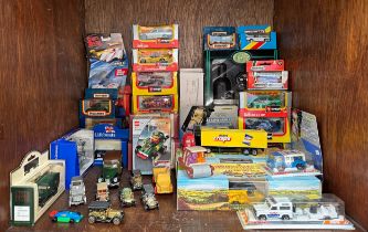 A collection of approximately forty assorted boxed die-cast scale model vehicles, comprising,