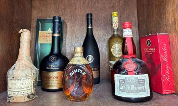 Seven assorted bottles of alcohol, comprising, a bottle of Grand Marnier Triple Orange, 1l, a