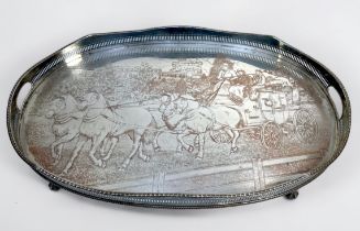 A large oval silver-plated serving tray, with pierced gallery, serpentine rim and pierced handles to