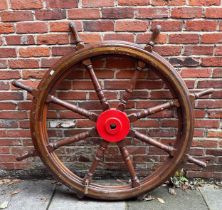 A large 19th century Ships Wheel, varnished oak with central red-painted iron boss/hub and flush