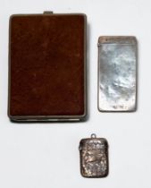 A silver calling card case and a silver vesta, together with a white metal and leather cigarette