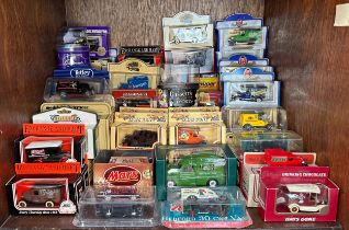 A large collection of boxed die-cast scale model vehicles, mostly promotional examples for various