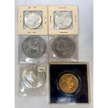 Two Kennedy half dollars, a world cup Willie coin in original plastic case and three commemorative