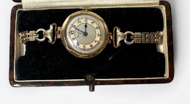 A ladies ‘The Angus’ 9ct gold cased wristwatch, the silvered dial with Arabic numerals denoting