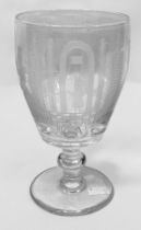A 19th century charging glass, decorated with engraved, cut and etched Masonic devices, raised on