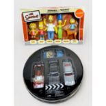 A Corgi Definitive Bond Collection set of four cars in circular fitted tin, with original packaging,