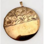A 9ct yellow gold large circlular locket, with half foliate engraving to the front, weighs 12.8