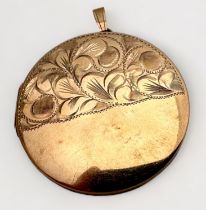 A 9ct yellow gold large circlular locket, with half foliate engraving to the front, weighs 12.8