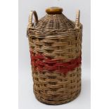 A Royal Navy Pusser's Rum stoneware flagon, with wicker outer sleeve (lacking contents) together