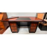 An Authentic Models captains desk, with inset black leather scribe to top and brass capped