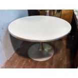 An Eero Saarinen 'Tulip' style circular table, with white top, raised on brushed aluminium base, top