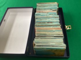 A box containing approximately 700 standard-size postcards from the 1970s/80s era – mostly British