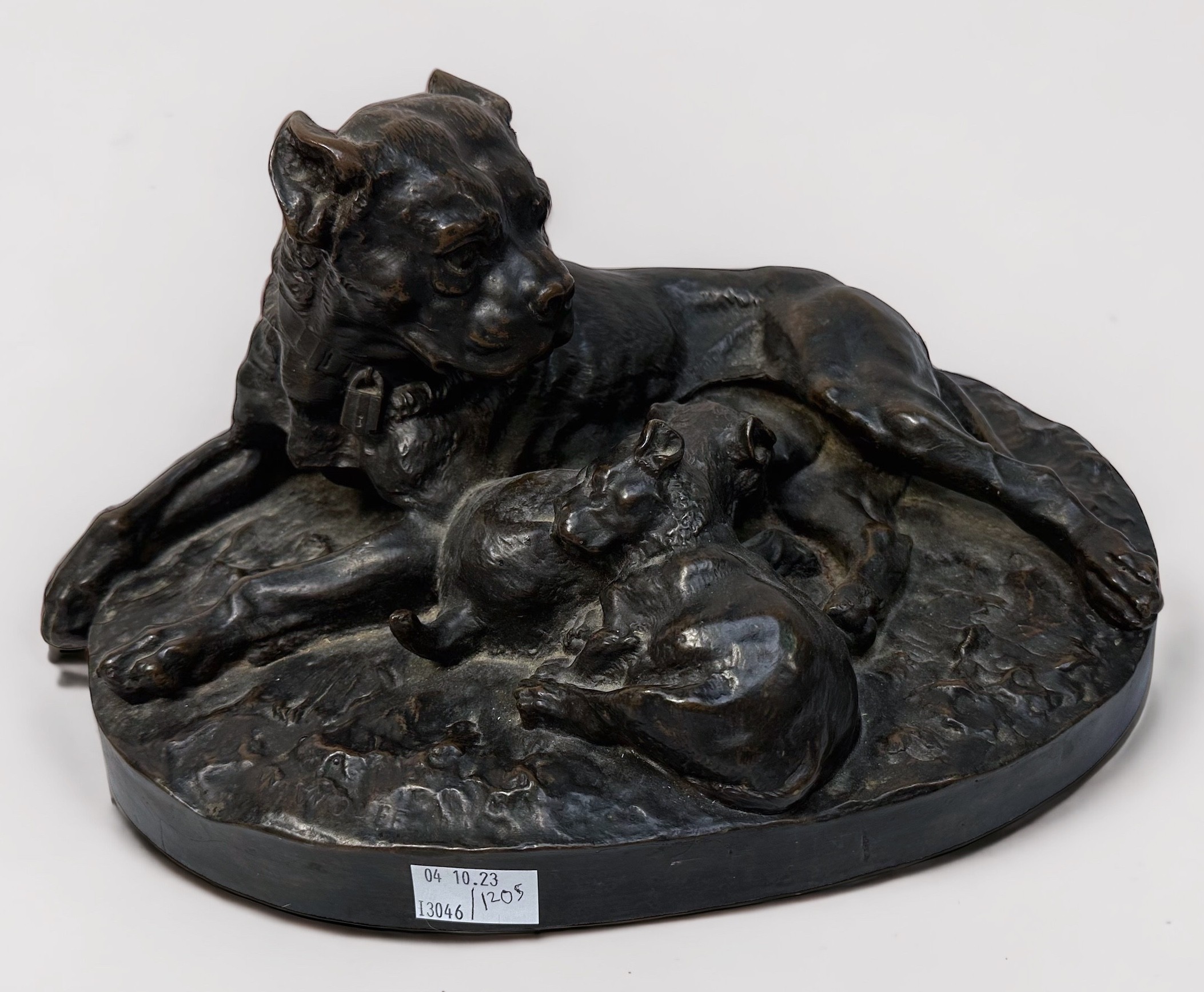 After W. Wolfe (German, 20th century) Bronzed sculpture of a Bull Mastiff and two pups, with