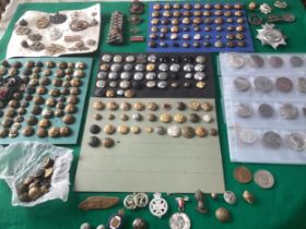A box of military badges; military, police and civilian buttons and various medallions (see last