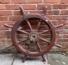 A wooden ships wheel with metal central hub, 100cm diameter, taken from the tugboat Abbria in