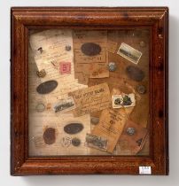 A framed collection of Railwayana including tickets, buttons, badges and ephemera, 46x46cm, together