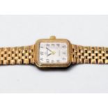 A ladies 9ct gold Garrard wristwatch, the rectangular white enamel dial with Arabic numerals