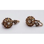 A pair of Edwardian 18ct yellow gold diamond cluster earrings, set with Rose Cut diamonds, estimated