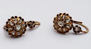 A pair of Edwardian 18ct yellow gold diamond cluster earrings, set with Rose Cut diamonds, estimated