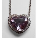 An 18ct white gold necklace, claw set with a heart shaped faceted amethyst to the centre, in a