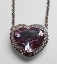 An 18ct white gold necklace, claw set with a heart shaped faceted amethyst to the centre, in a