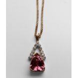 A 14ct yellow gold pink topaz and diamond pendant and 18ct yellow gold curb chain, the heart