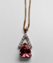 A 14ct yellow gold pink topaz and diamond pendant and 18ct yellow gold curb chain, the heart