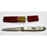 A George III Silver and Mother-of-Pearl folding fruit knife, with vacant cartouche and 'bright