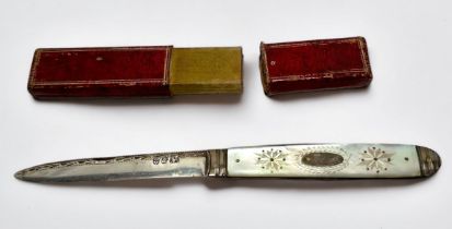 A George III Silver and Mother-of-Pearl folding fruit knife, with vacant cartouche and 'bright