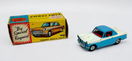 A boxed Corgi Toys ‘231’ Triumph Herald Coupé, finished in blue and white, red interior, with chrome