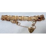 A 9ct yellow gold four-bar gate bracelet, with heart-shaped padlock, weight 8.7 grams.