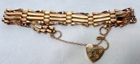 A 9ct yellow gold four-bar gate bracelet, with heart-shaped padlock, weight 8.7 grams.