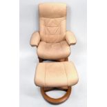 A cream leather reclining swivel armchair and matching footstool
