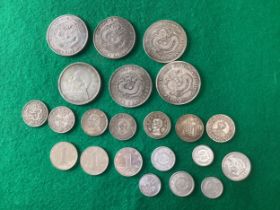 A quantity of mainly white metal Chinese coins, all photographed obverse and reverse.