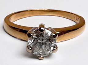 An 18ct yellow gold solitaire diamond ring, the round brilliant cut diamond weighing approximately