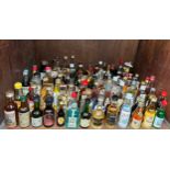 A collection of approximately one-hundred assorted bottles of alcohol miniatures, sealed and some
