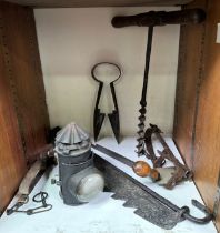 A small collection of assorted wrought iron and tools including a shaving blade, various animal