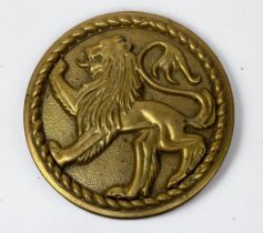 A Circular Brass Tampion/muzzle cover for an 8-inch naval gun, cast with a Lion Passant in rope-