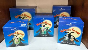 Five boxed Wallace and Gromit items by Border Fine Arts, comprising salt and pepper pots, a mug, egg